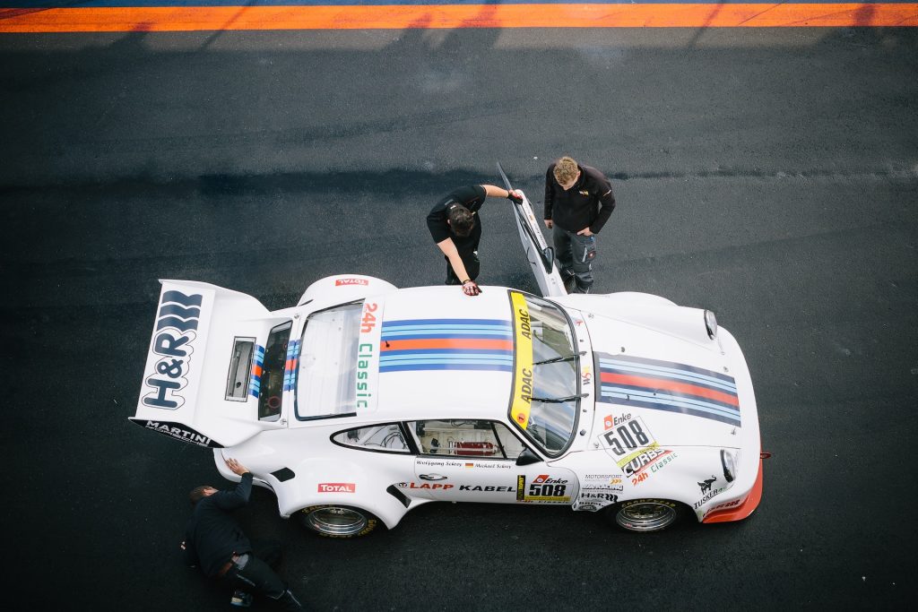 inspecting a race car
