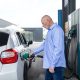 man fueling car